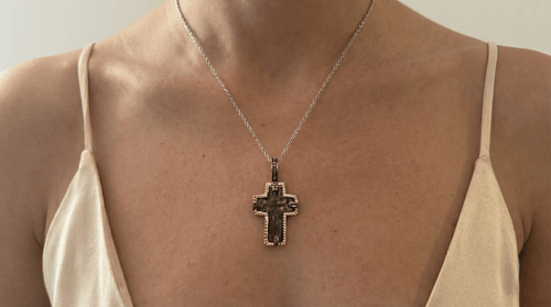 17th-18th century Christiancross pendant in rose gold-plated sterling silver with natural diamonds worn on a chain against skin