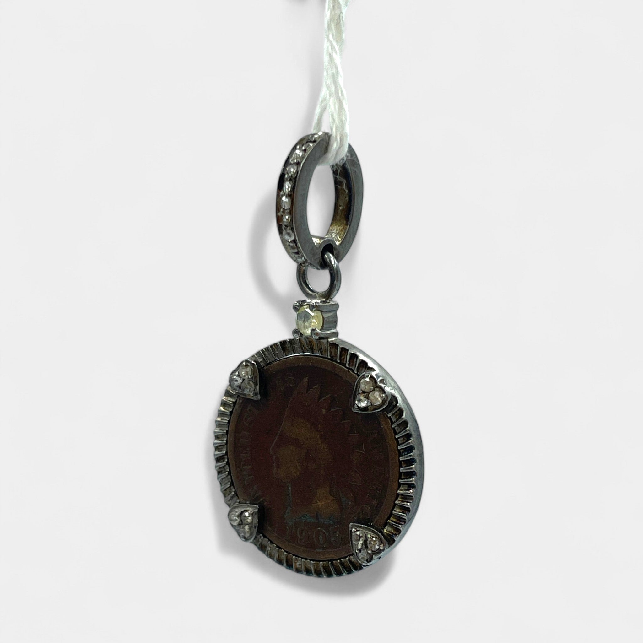 Left side  view of handmade sterling silver pendant featuring authentic 1905 Indian Head Penny copper coin with 24 natural diamonds 0.36ct – Tanya Telish vintage jewelry